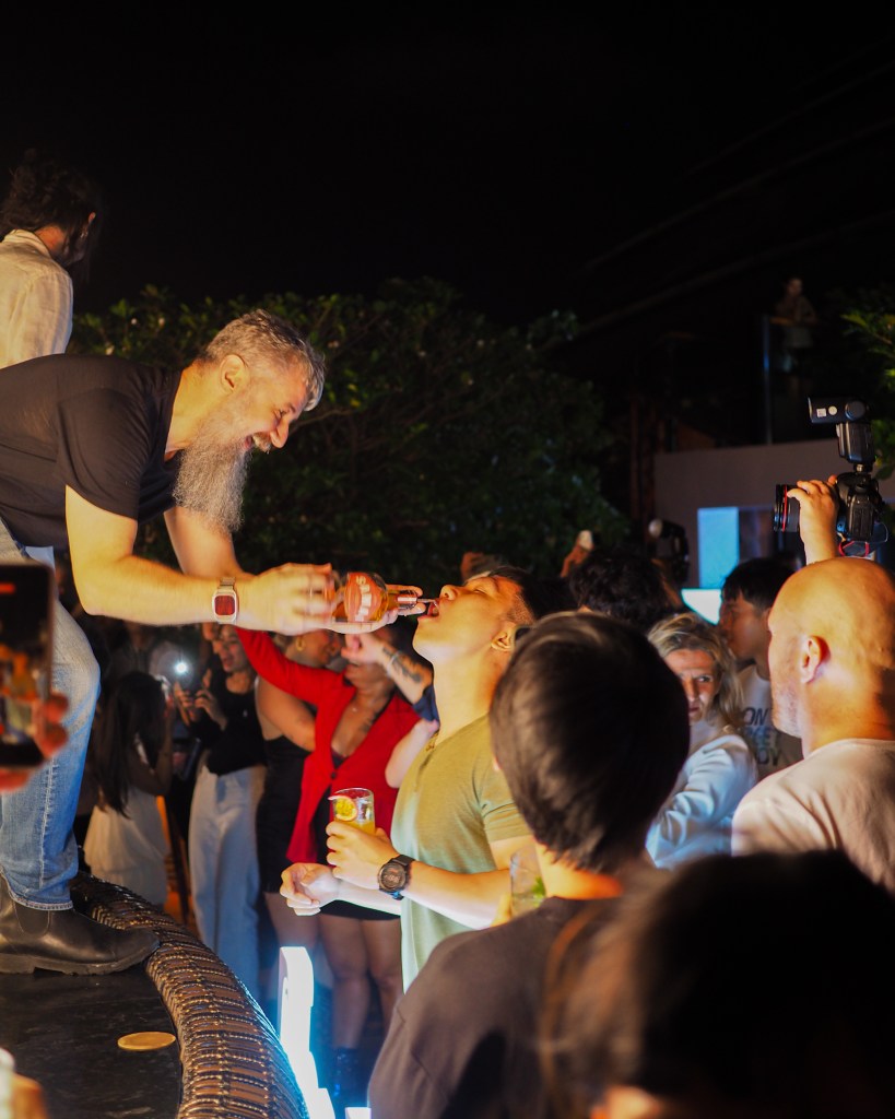 Guests celebrating with cocktails and shots during the sold-out final night of the Phnom Penh Cocktail Festival at Sora.